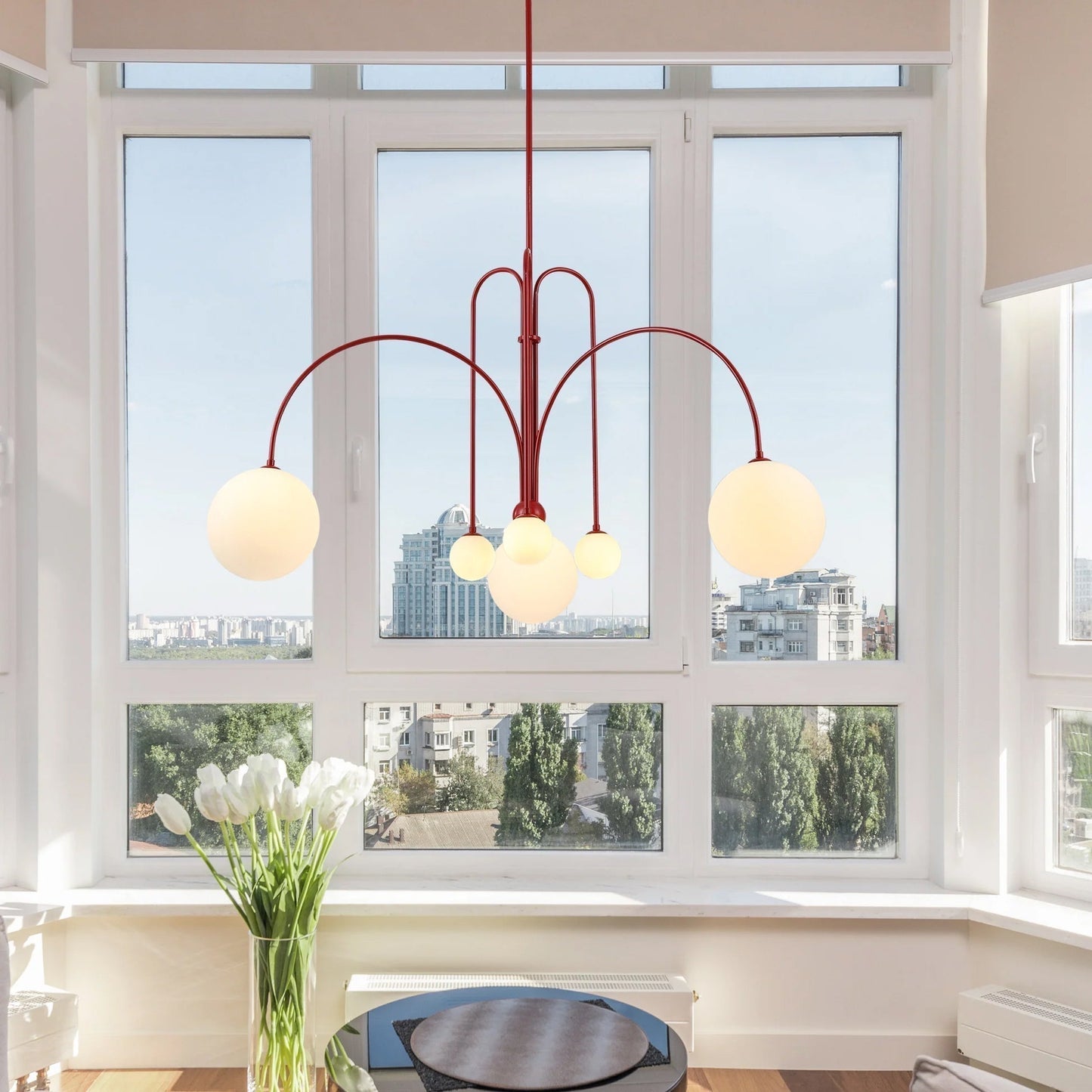 Elegant modern glass pendant light designed for kitchens and dining spaces, featuring a slim profile and available in multiple sizes, enhancing any contemporary decor. 1