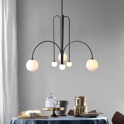 Elegant modern glass pendant light designed for kitchens and dining spaces, featuring a slim profile and available in multiple sizes, enhancing any contemporary decor. 2