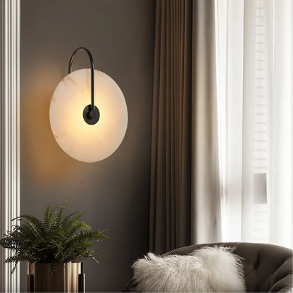 Modern LED wall lamp featuring a sleek golden arm and a stylish marble shade, perfect for minimalist home decor and elegant lighting solutions. 3