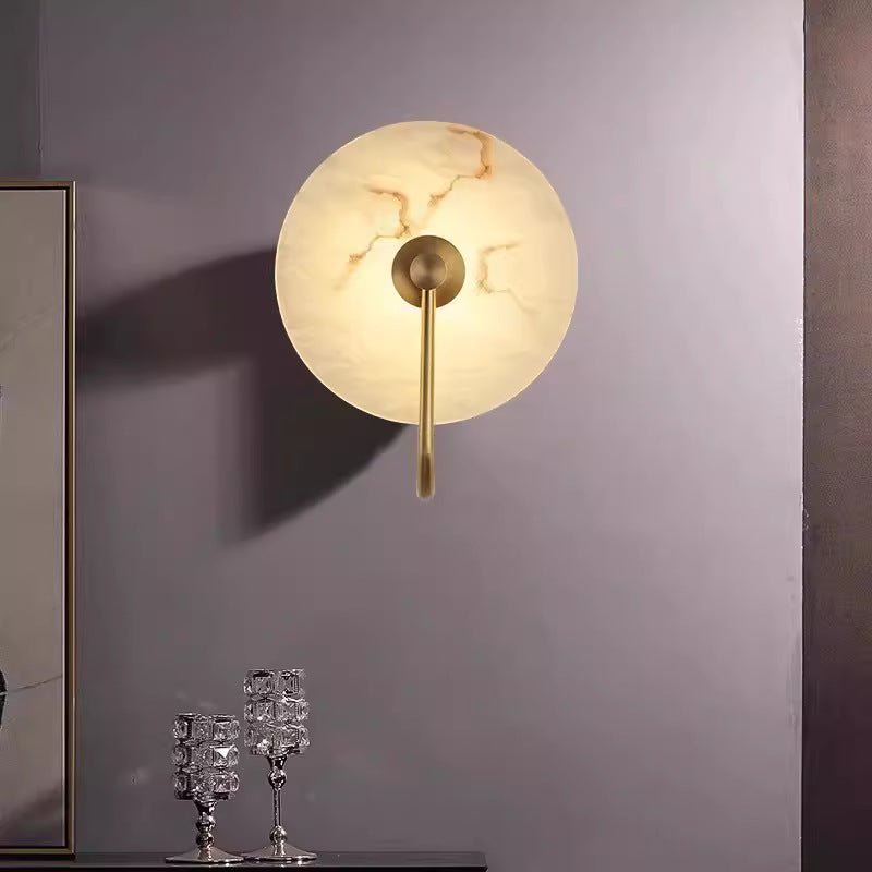 Modern LED wall lamp featuring a sleek golden arm and a stylish marble shade, perfect for minimalist home decor and elegant lighting solutions. 2