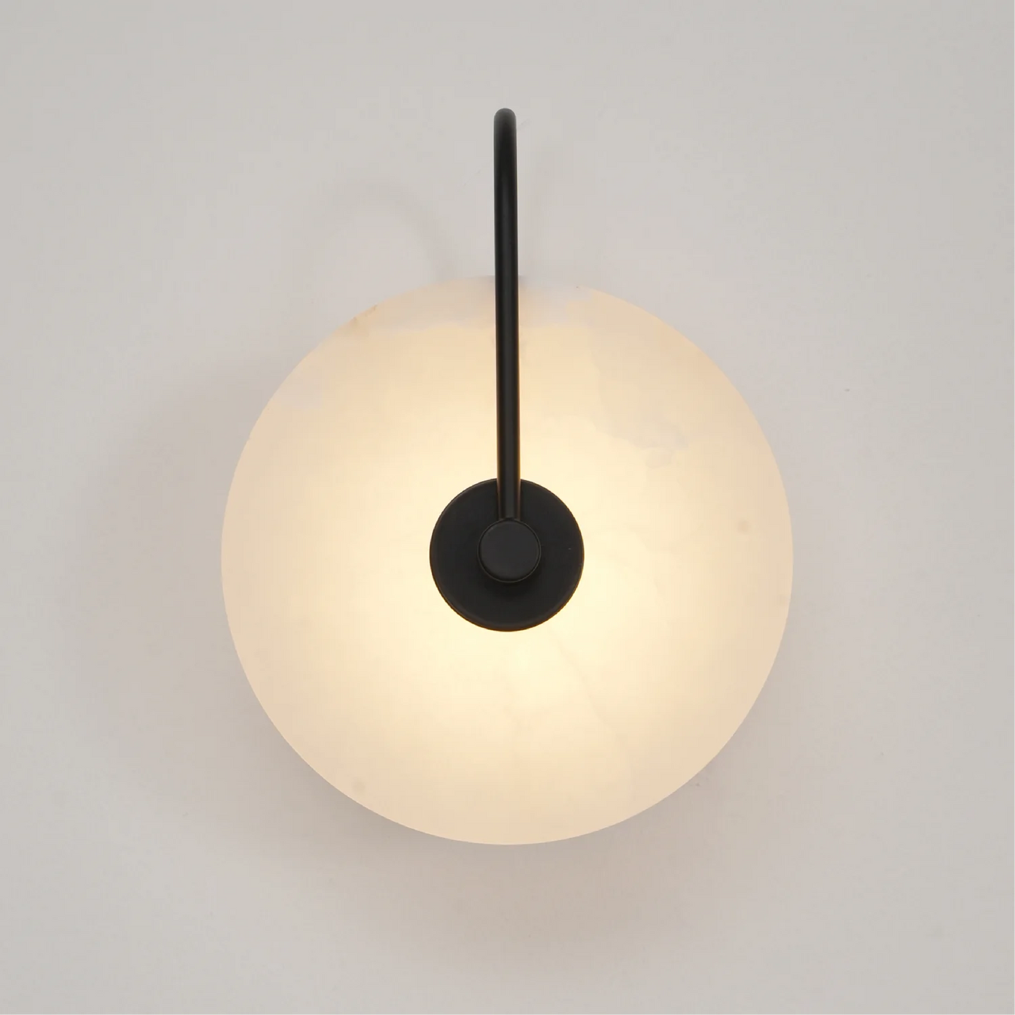 Modern LED wall lamp featuring a sleek golden arm and a stylish marble shade, perfect for minimalist home decor and elegant lighting solutions. 0