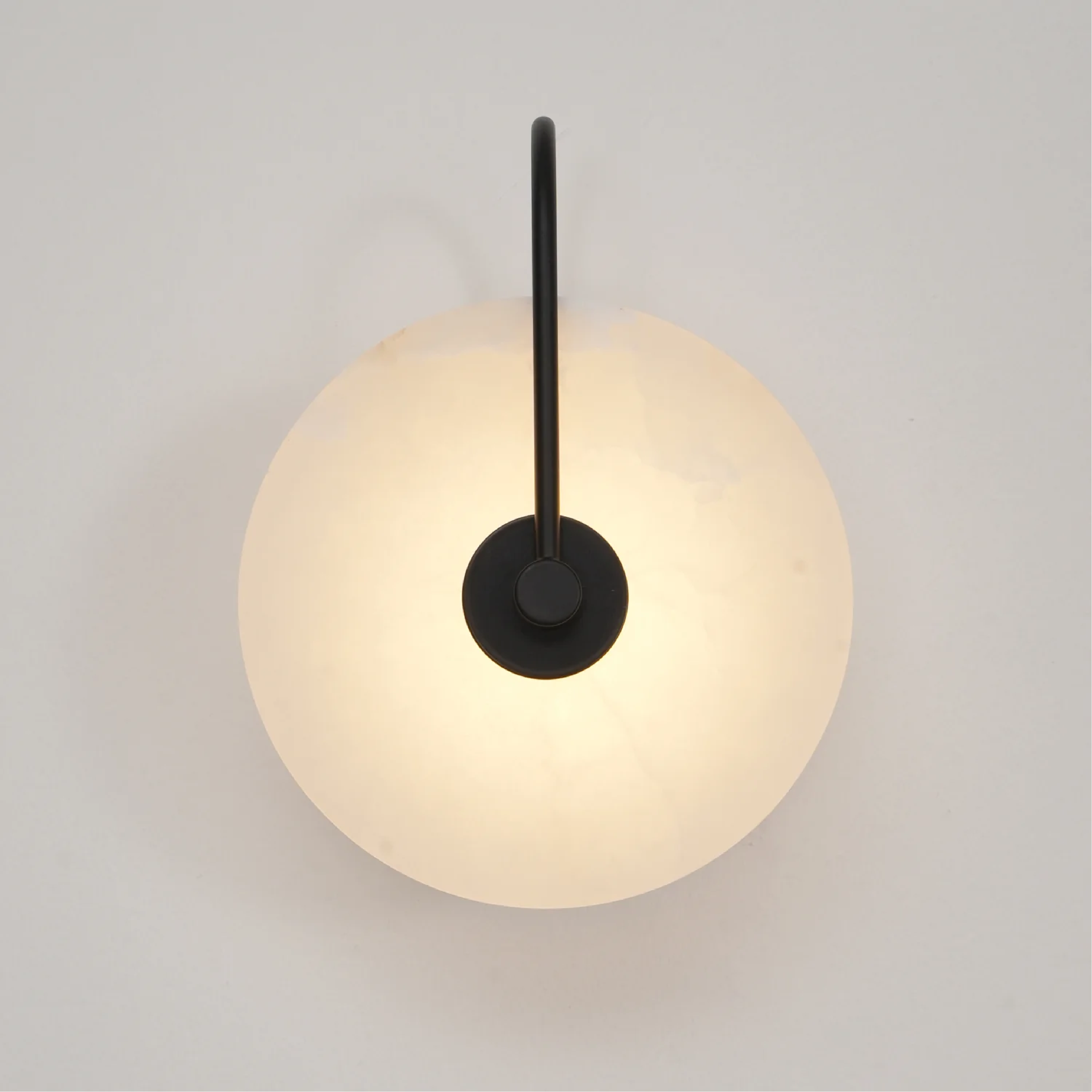 Modern LED wall lamp featuring a sleek golden arm and a stylish marble shade, perfect for minimalist home decor and elegant lighting solutions. 0