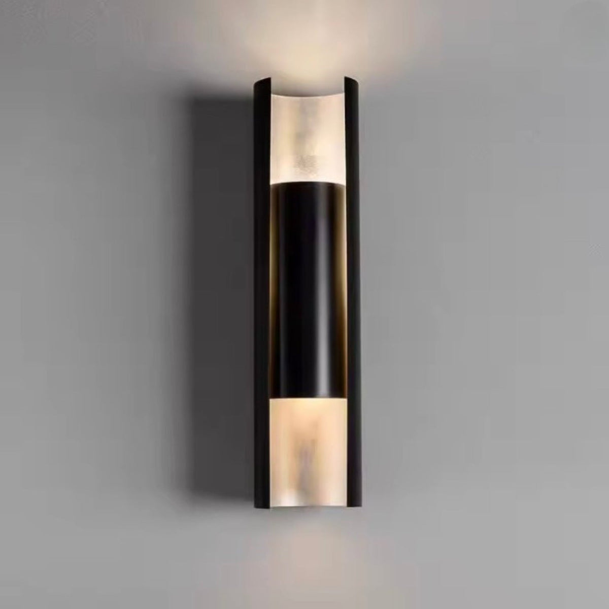Modern minimalist wall lamp featuring a sleek stainless steel finish, designed to provide both upward and downward lighting for a contemporary ambiance in any room. 2