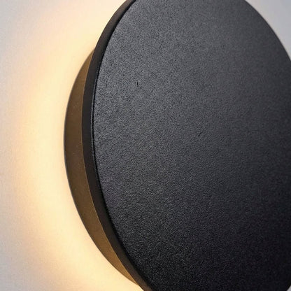 Modern outdoor wall lamp featuring a durable stainless steel round design, IP65 weatherproof rating, perfect for illuminating gardens and terraces. 2