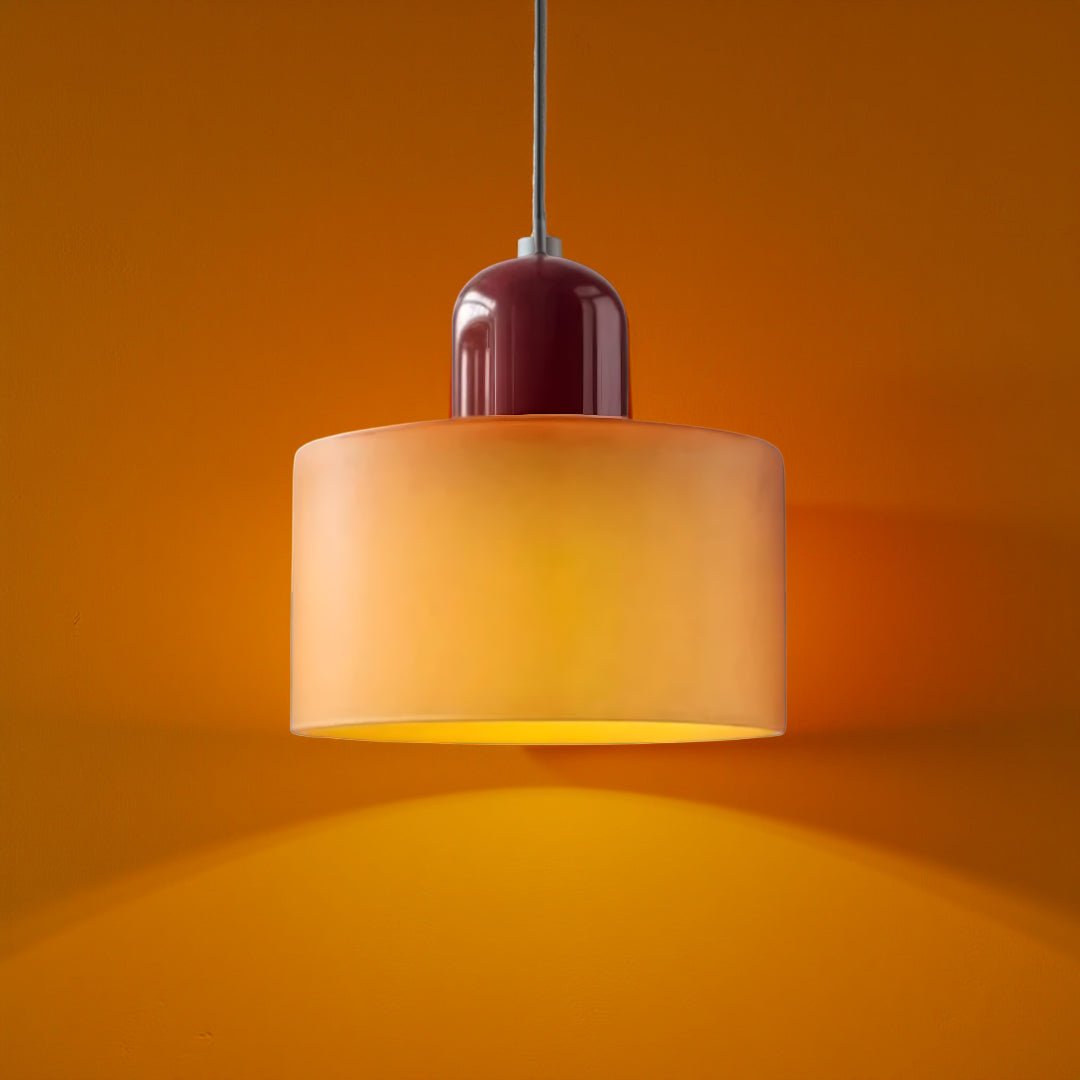Modern pendant light featuring a sleek design with a glass shade, ideal for illuminating kitchen islands and dining areas. 0