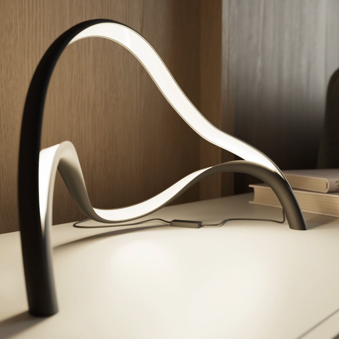 Modern table lamp featuring an integrated LED light with a sleek metal and acrylic finish, designed for compact use on bedside tables or desks. 4