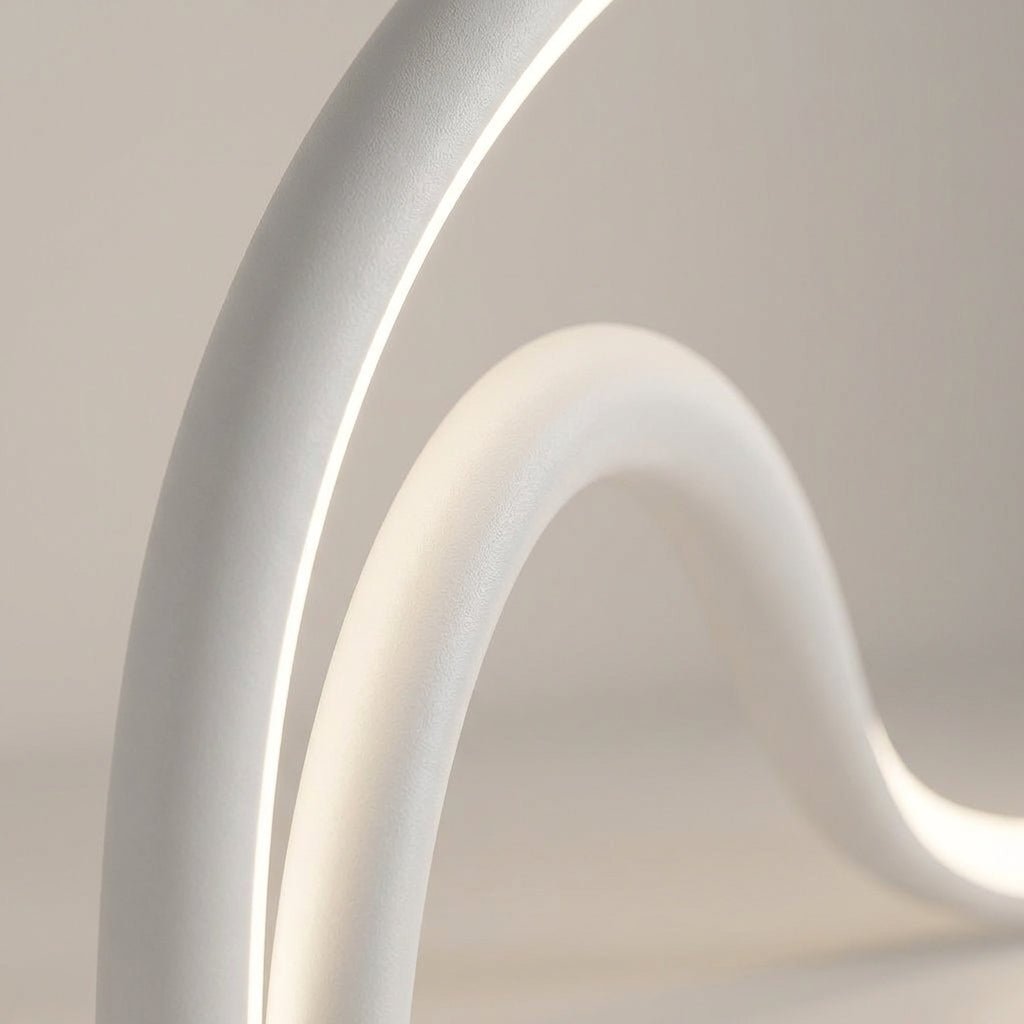 Modern table lamp featuring an integrated LED light with a sleek metal and acrylic finish, designed for compact use on bedside tables or desks. 2