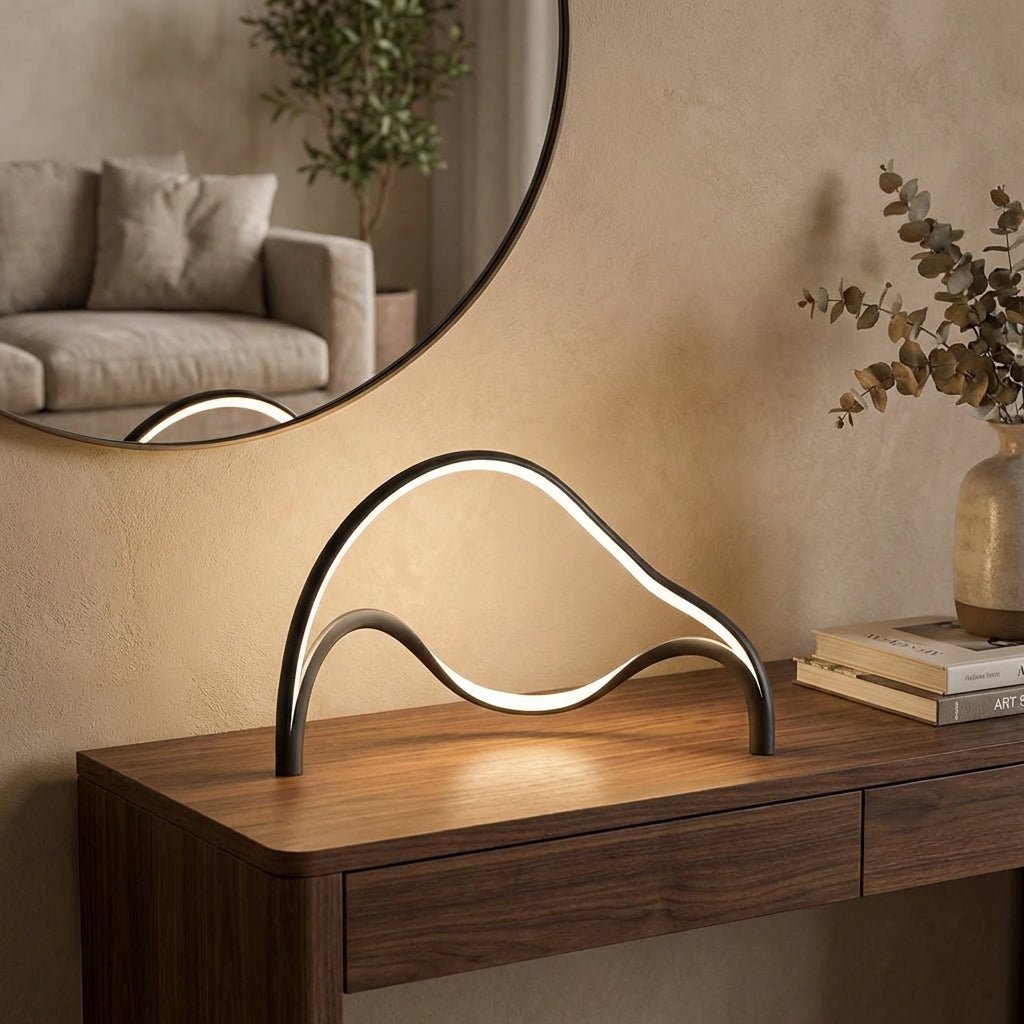 Modern table lamp featuring an integrated LED light with a sleek metal and acrylic finish, designed for compact use on bedside tables or desks. 0