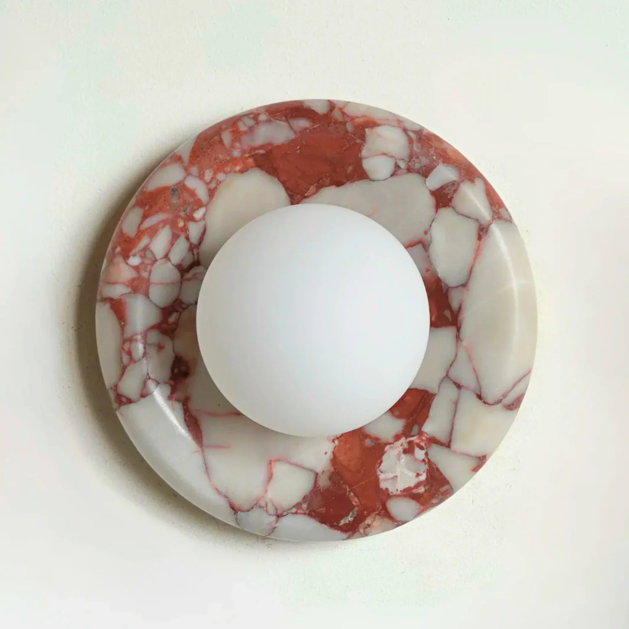 Modern wall lamp featuring a sleek marble design and frosted glass shade, perfect for contemporary décor, with energy-efficient LED lighting. 0