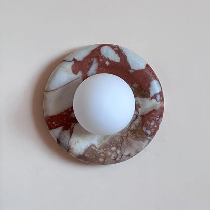 Modern wall lamp featuring a sleek marble design and frosted glass shade, perfect for contemporary décor, with energy-efficient LED lighting. 1