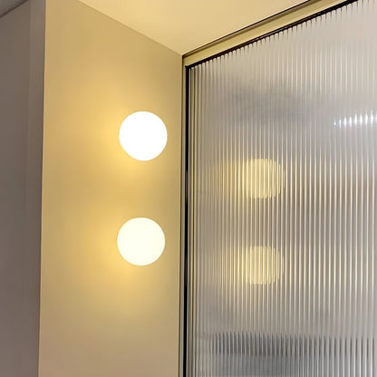 Modern wall lamp featuring a frosted glass shade, showcasing a sleek minimalist design perfect for contemporary decor and stylish wall sconce lighting. 3