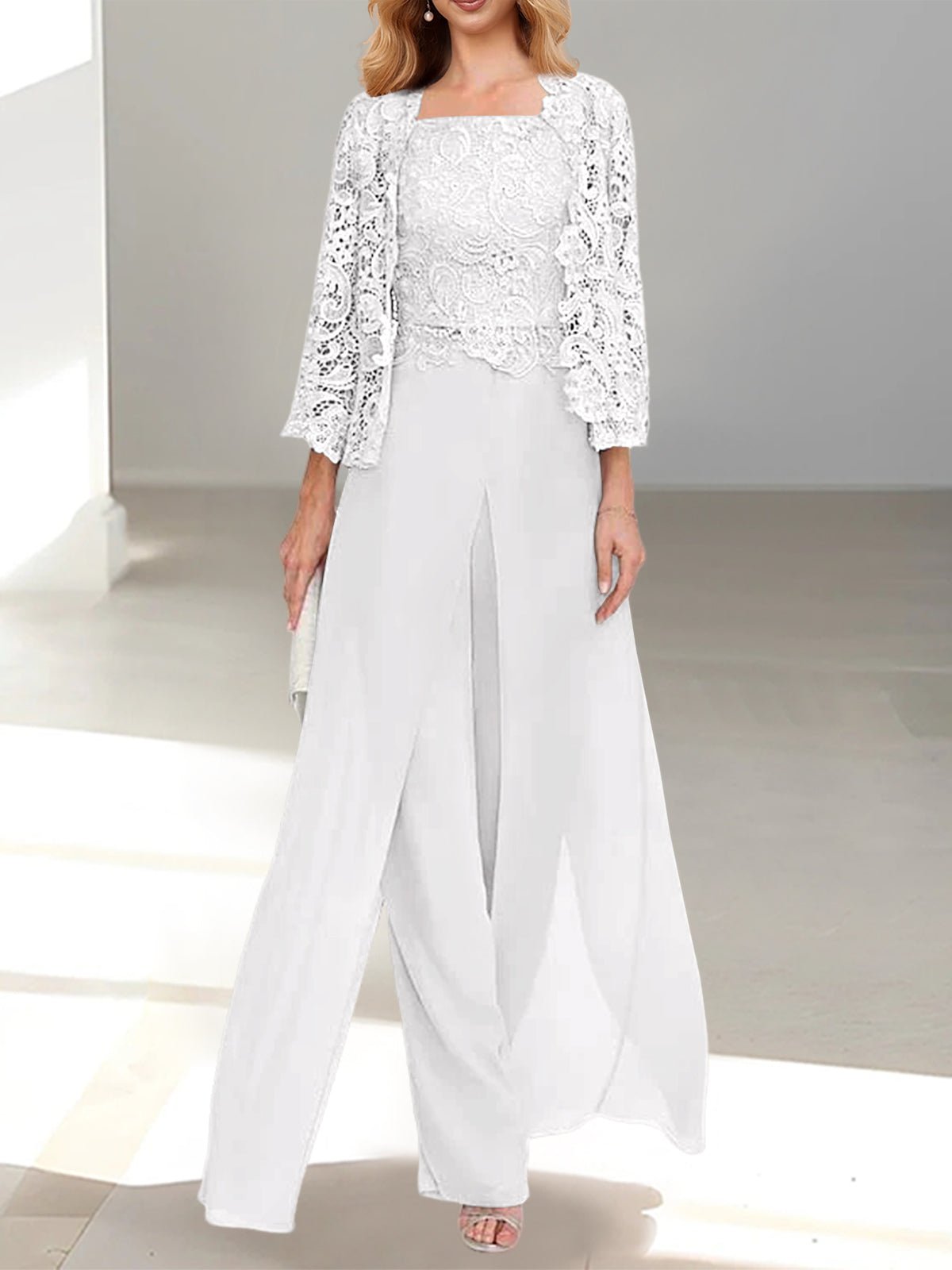 Elegant Mother of the Bride pantsuit featuring a stylish jacket and split side design, crafted from floor-length chiffon in sophisticated silver gray. 32