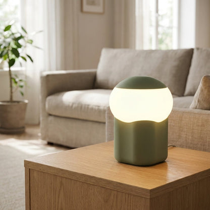 Mushroom table lamp featuring a modern minimalist design with soft LED light, perfect for bedside and nightstand use. 1
