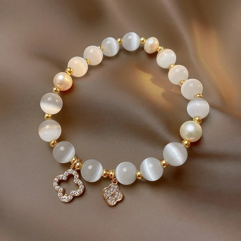 Natural crystal and pearl bracelet featuring an adjustable gold-plated chain, designed for emotional wellbeing and stylish elegance. 1