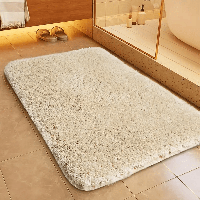 Non-slip bath mat featuring a luxurious soft textile design, providing enhanced comfort and stability for a safe and stylish bathroom experience. 0