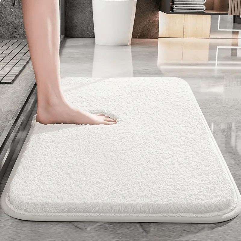 Non-slip bath mat featuring a luxurious soft textile design, providing enhanced comfort and stability for a safe and stylish bathroom experience. 1