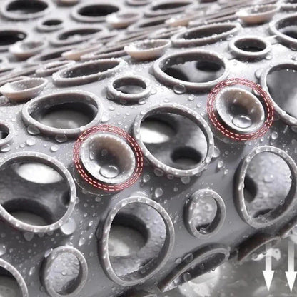 Non-slip shower mat featuring strong suction cups for stability, quick drainage holes for efficient water flow, and mold-resistant material for a hygienic bathroom experience. 4