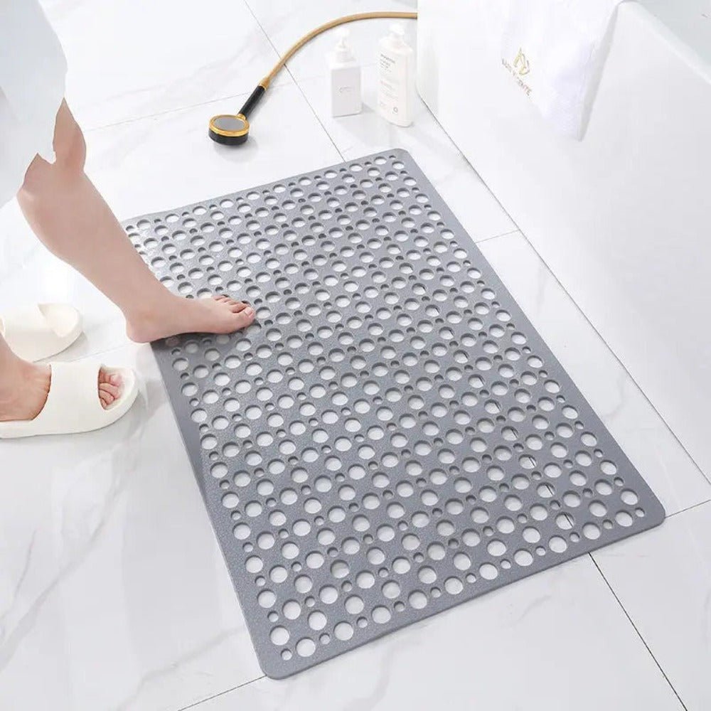 Non-slip shower mat featuring strong suction cups for stability, quick drainage holes for efficient water flow, and mold-resistant material for a hygienic bathroom experience. 3