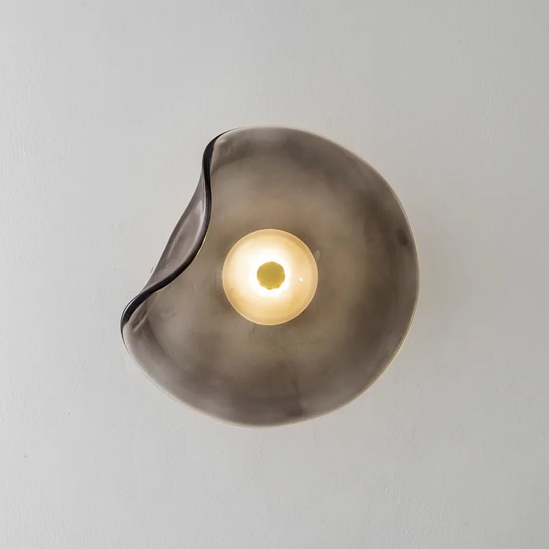 Nordic glass wall lamp featuring a modern art design, showcasing atmospheric lighting in multiple colors, perfect for enhancing home decor. 5