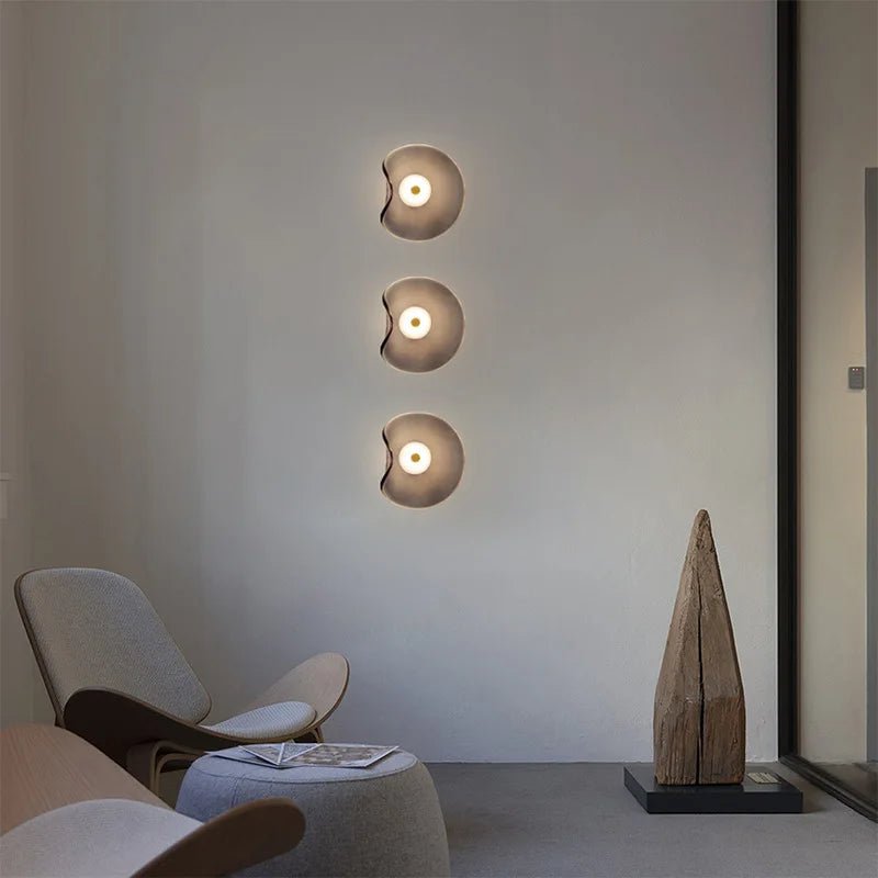 Nordic glass wall lamp featuring a modern art design, showcasing atmospheric lighting in multiple colors, perfect for enhancing home decor. 2