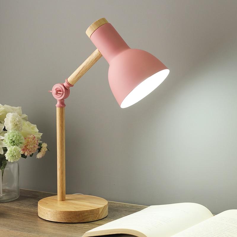 Nordic table lamp with adjustable height, featuring a wooden finish, perfect for minimalist bedside or desk decor. 8