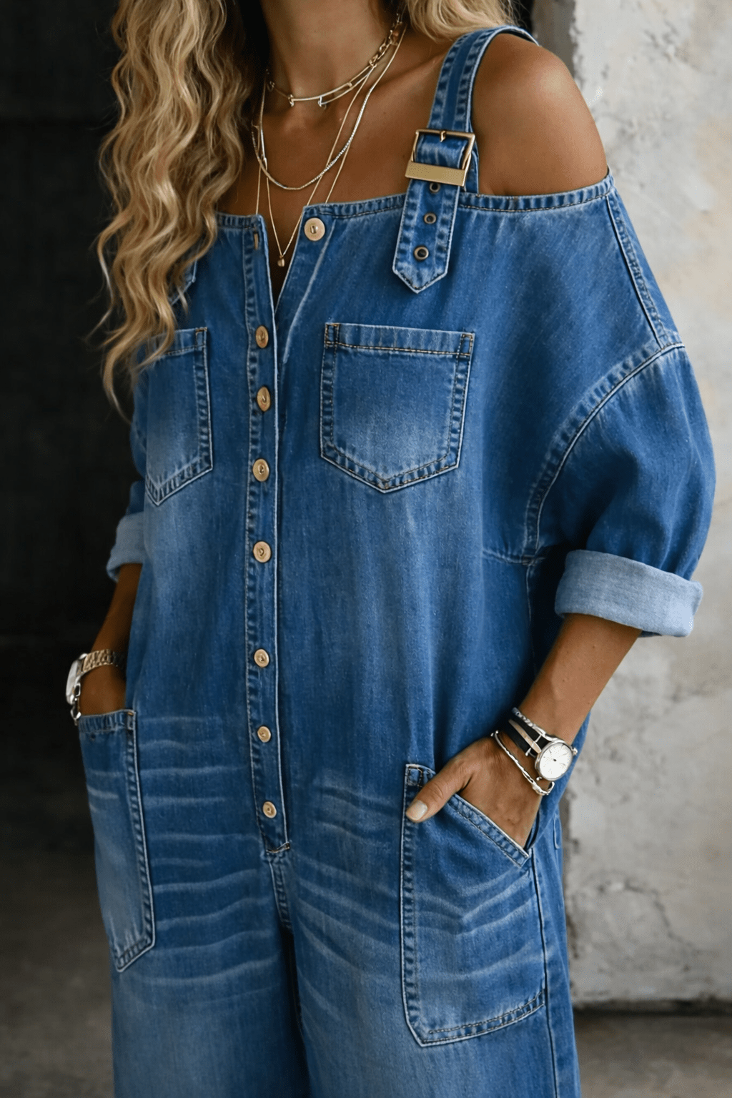 Off shoulder denim jumpsuit for women featuring a square neckline and convenient side pockets, perfect for casual everyday wear. 1