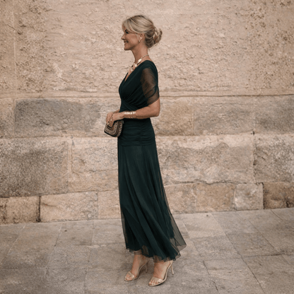 Elegant off-shoulder maxi dress in draped chiffon featuring a flattering mermaid silhouette, perfect for formal occasions, designed for women. 1