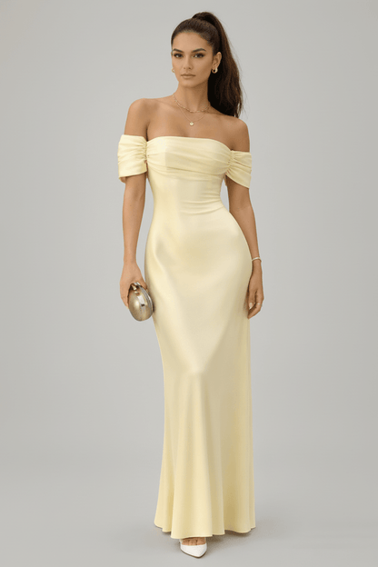 Off-shoulder maxi dress in soft fabric, featuring a flowing design, perfect for summer events and elegant occasions. 0