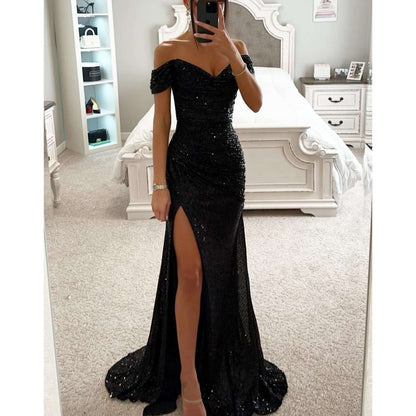 Off-shoulder maxi dress featuring a thigh-high slit and sweetheart neckline, adorned with an all-over sequin finish for a glamorous look. 11