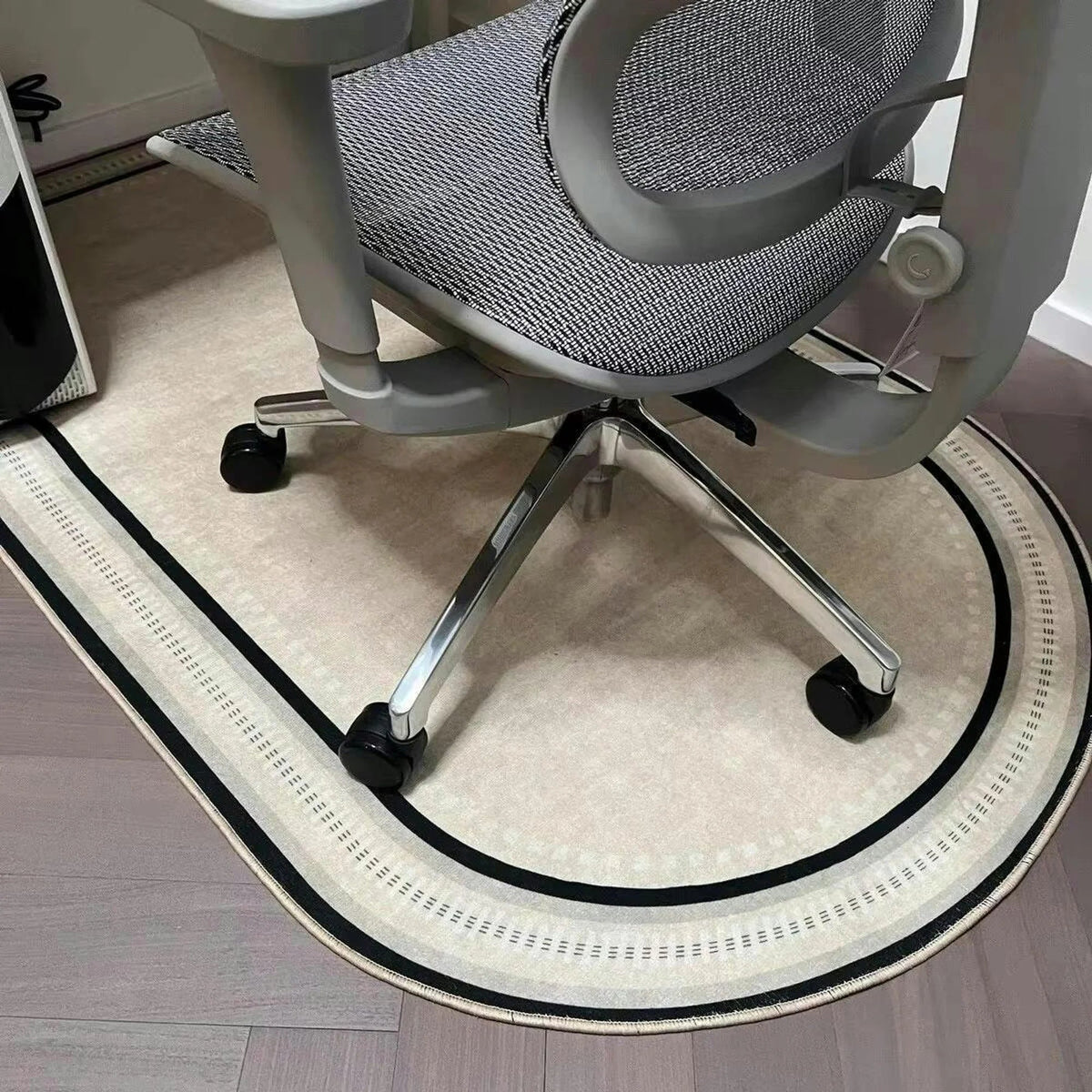 Office chair mat for carpet featuring a modern geometric design, non-slip backing, and a smooth rolling surface, ideal for protecting floors and enhancing workspace aesthetics. 1