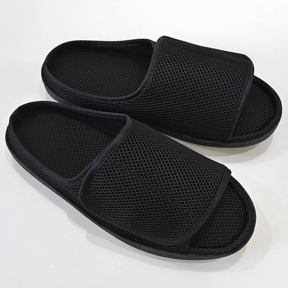 Openable slippers designed for swollen feet featuring an adjustable Velcro fit and a soft mesh upper for maximum comfort. 0