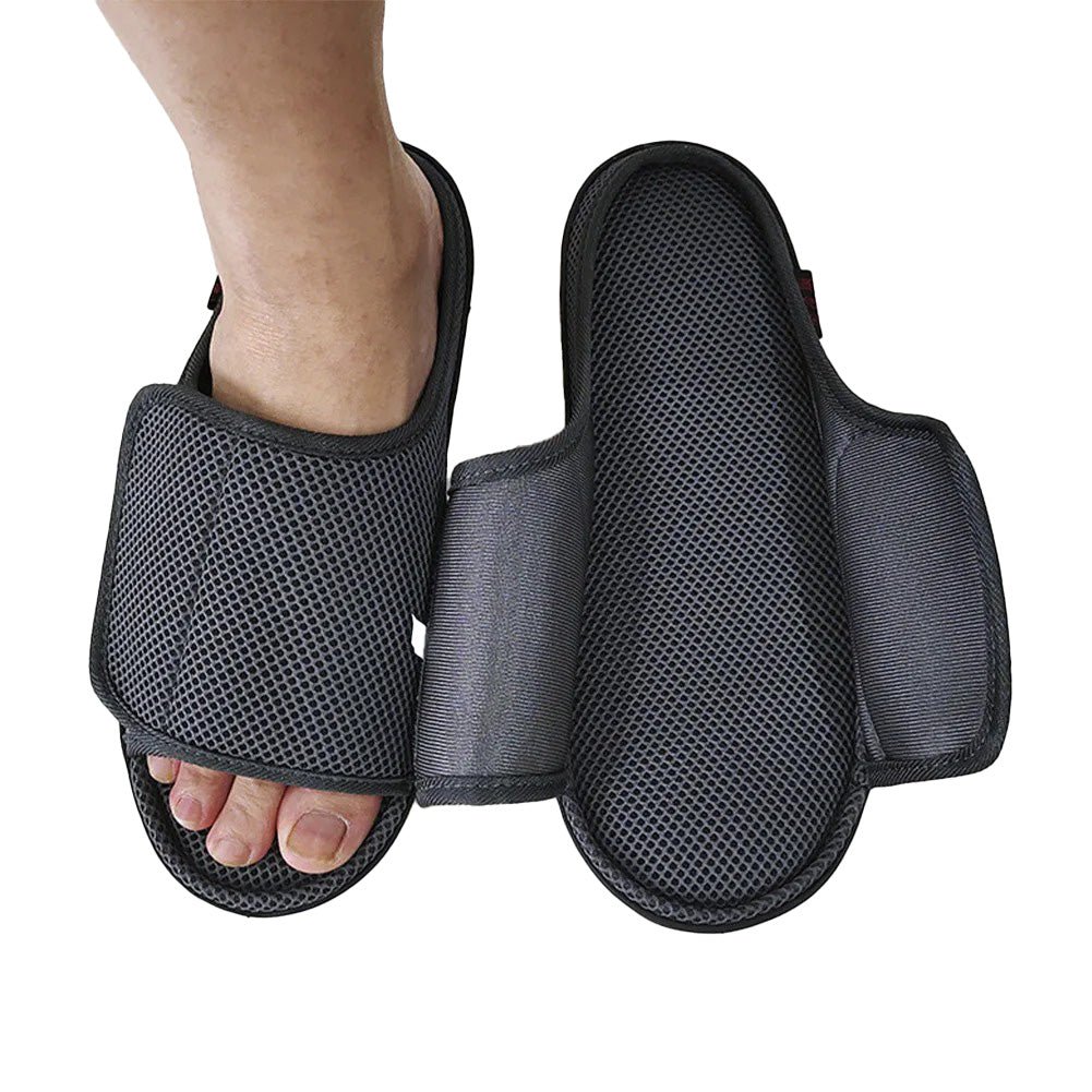 Openable slippers designed for swollen feet featuring an adjustable Velcro fit and a soft mesh upper for maximum comfort. 1