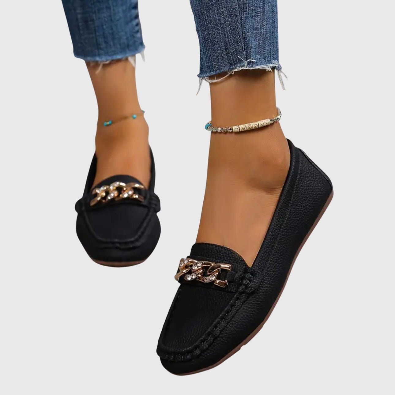 Orthopedic loafers featuring a cushioned insole and anti-slip sole, designed with a timeless style and elegant gold-chain detail. 9