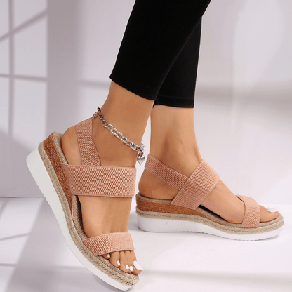 Lightweight orthopedic platform sandals featuring elastic straps and a sporty sole, designed for comfort and support, made from vegan materials. 2