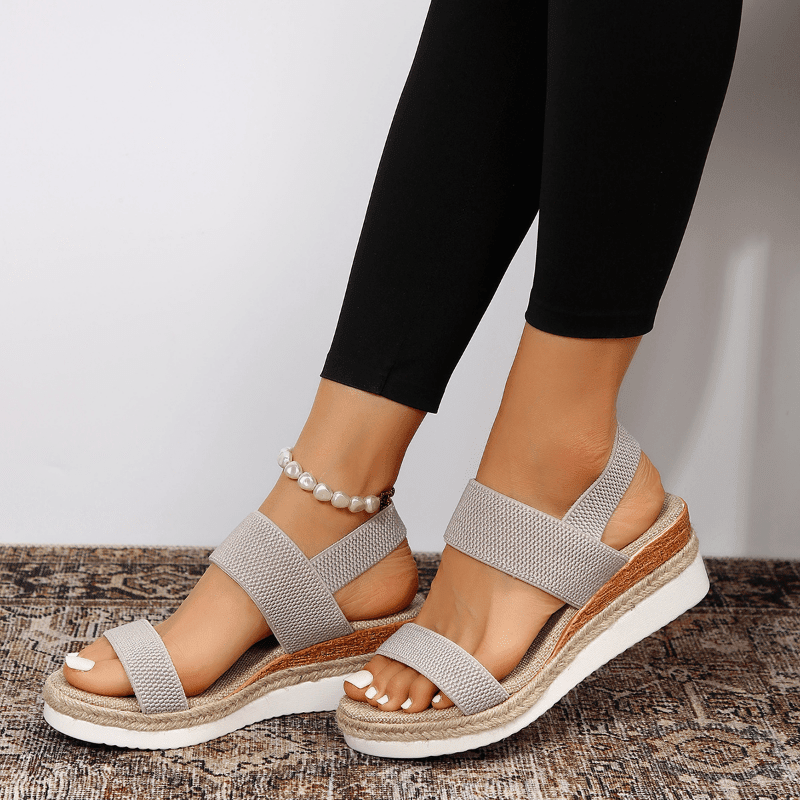 Lightweight orthopedic platform sandals featuring elastic straps and a sporty sole, designed for comfort and support, made from vegan materials. 8