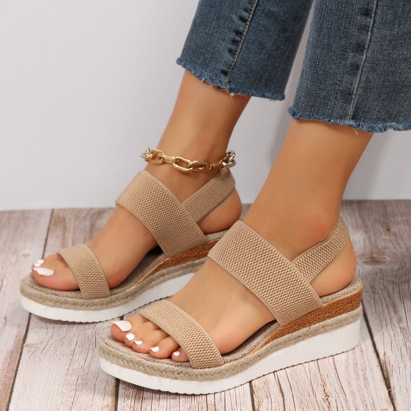 Lightweight orthopedic platform sandals featuring elastic straps and a sporty sole, designed for comfort and support, made from vegan materials. 1