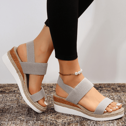 Orthopedic sandals for women featuring elastic straps, designed for comfort with a lightweight breathable platform, ideal for all-day wear. 10