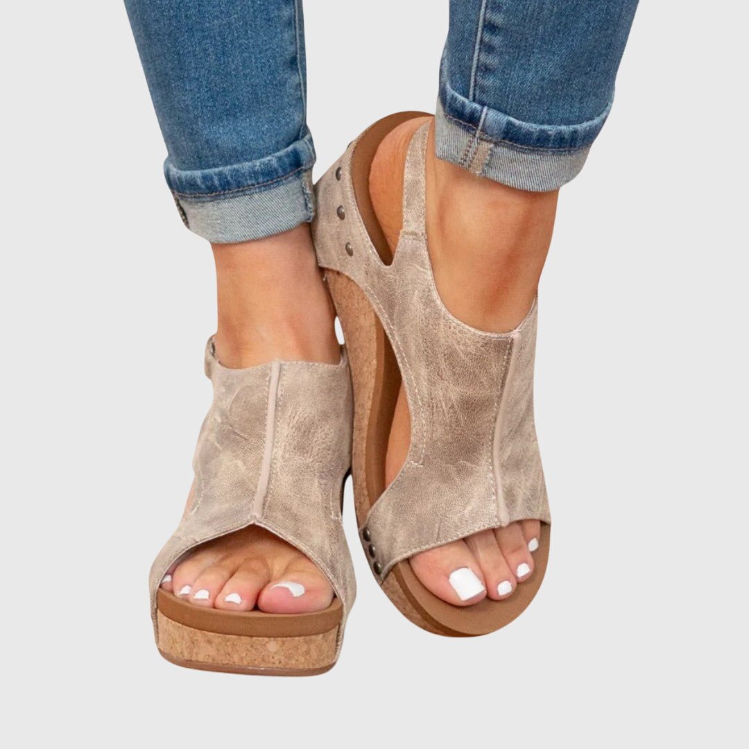 Orthopedic sandals featuring a cushioned insole and adjustable buckle for a comfortable fit, designed with a lightweight and versatile style suitable for everyday wear. 1