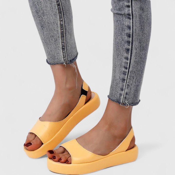Orthopedic sandals featuring a cushioned insole and shock-absorbing sole, designed for comfortable slip-on summer wear. 8
