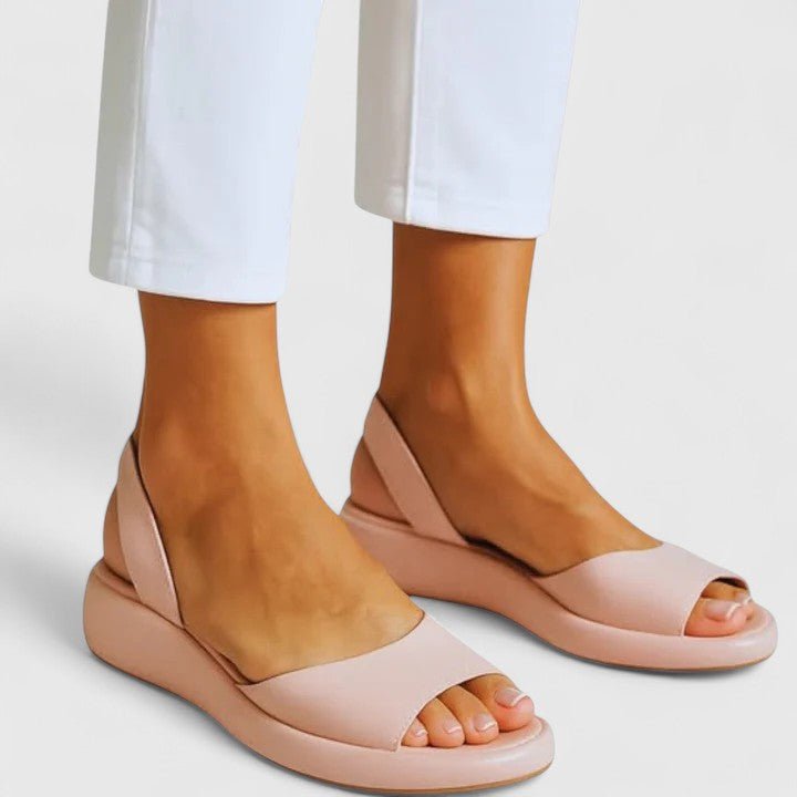 Orthopedic sandals featuring a cushioned insole and shock-absorbing sole, designed for comfortable slip-on summer wear. 4