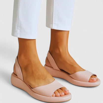Orthopedic sandals featuring a cushioned insole and shock-absorbing sole, designed for comfortable slip-on summer wear. 4