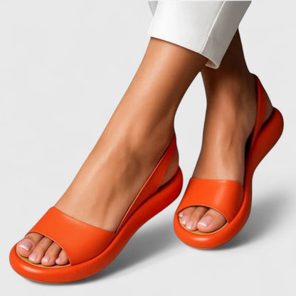 Orthopedic sandals featuring a cushioned insole and shock-absorbing sole, designed for comfortable slip-on summer wear. 2