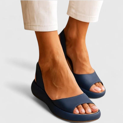 Orthopedic sandals featuring a cushioned insole and shock-absorbing sole, designed for comfortable slip-on summer wear. 3