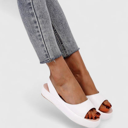 Orthopedic sandals featuring a cushioned insole and shock-absorbing sole, designed for comfortable slip-on summer wear. 9