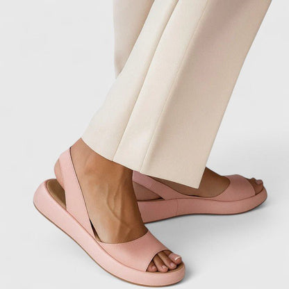 Orthopedic sandals featuring a cushioned insole and shock-absorbing sole, designed for comfortable slip-on summer wear. 1