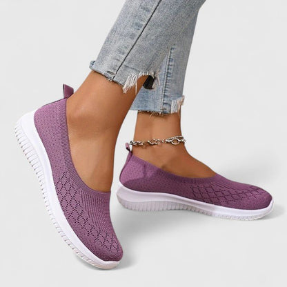 Orthopedic slip-on women's shoes featuring a shock-absorbing design and a comfortable minimalist style, perfect for everyday wear. 1
