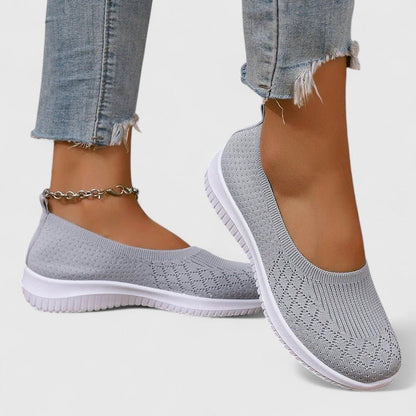 Orthopedic slip-on women's shoes featuring a shock-absorbing design and a comfortable minimalist style, perfect for everyday wear. 0