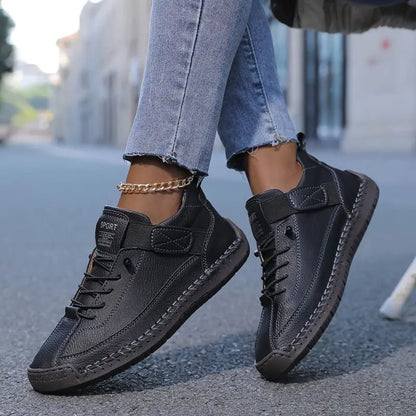 Orthopedic sneakers designed for all-day support and comfort, featuring a wide fit to accommodate various foot shapes and sizes. 0