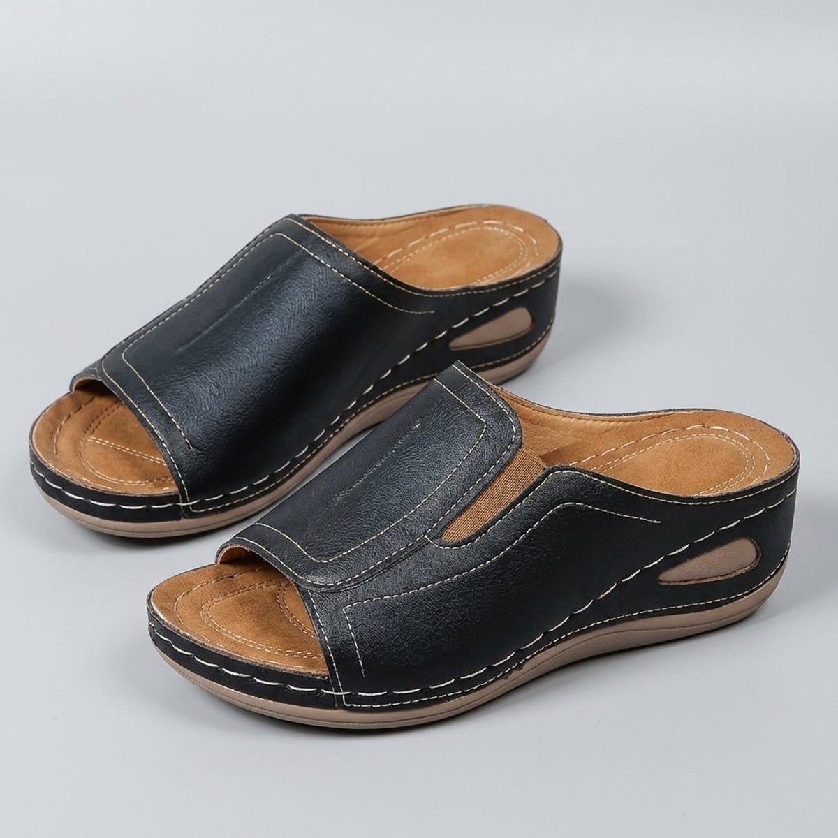 Orthopedic wedge sandals for women featuring arch support, open-toe design, and slip-on leather comfort, perfect for all-day wear. 4