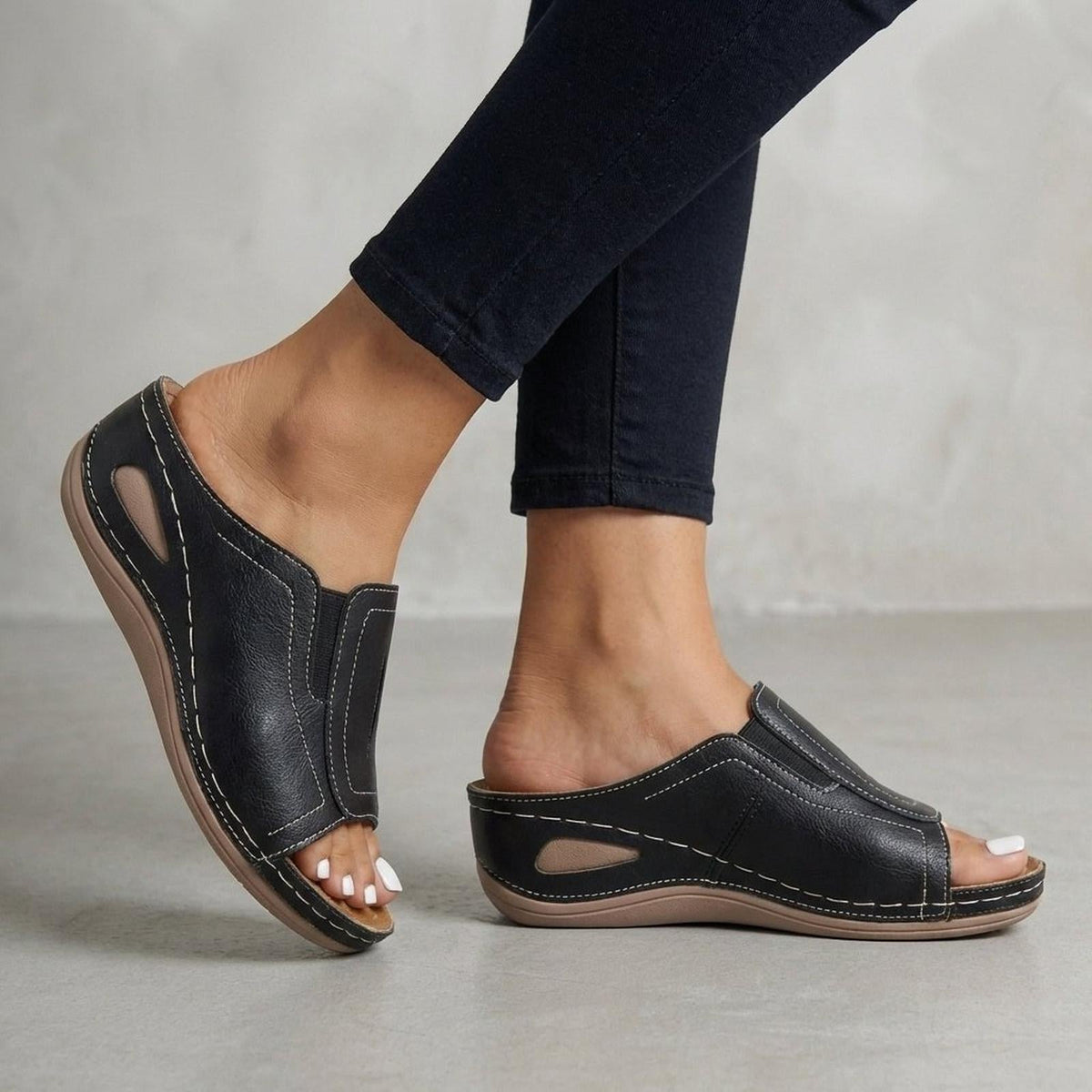 Orthopedic wedge sandals for women featuring arch support, open-toe design, and slip-on leather comfort, perfect for all-day wear. 2